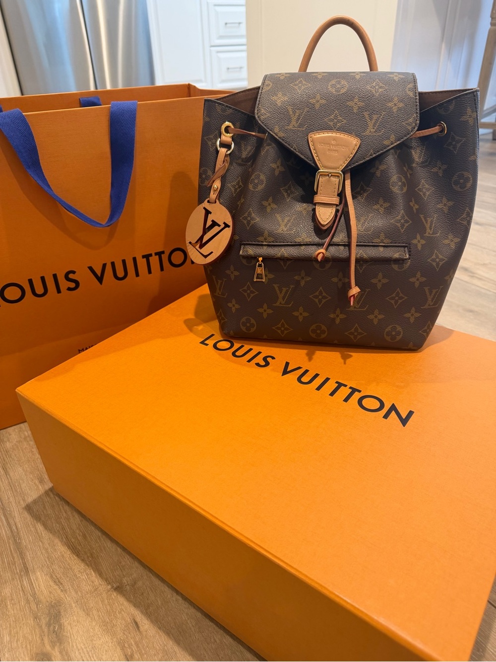 Louis Vuitton Monogram Canvas Drawstring Backpack in Brown and Tan